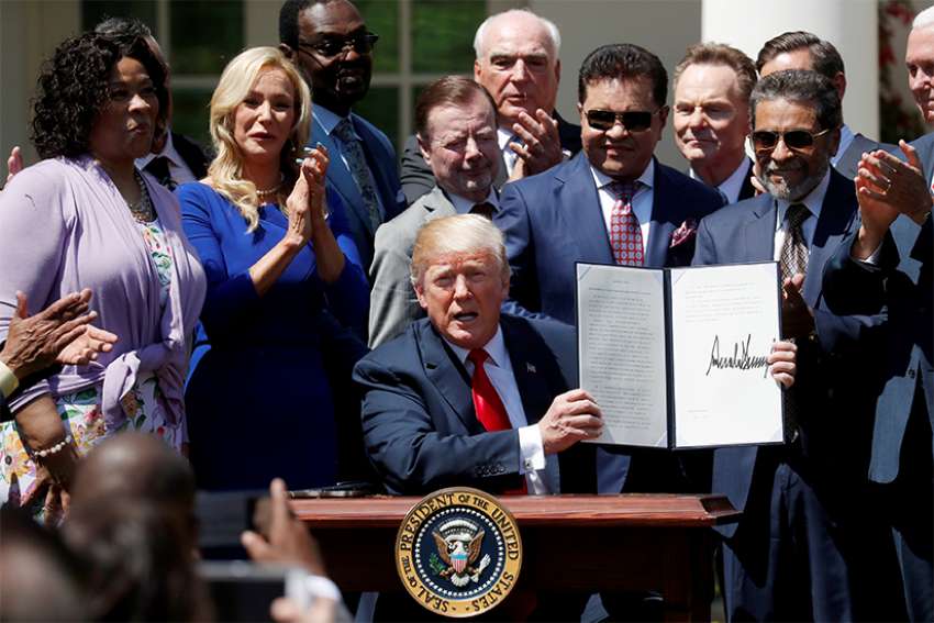 Trump signs order to give faith groups stronger voice in government