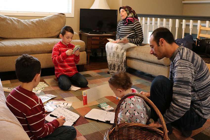 It's families helping families as Catholics, others aid Syrian refugees