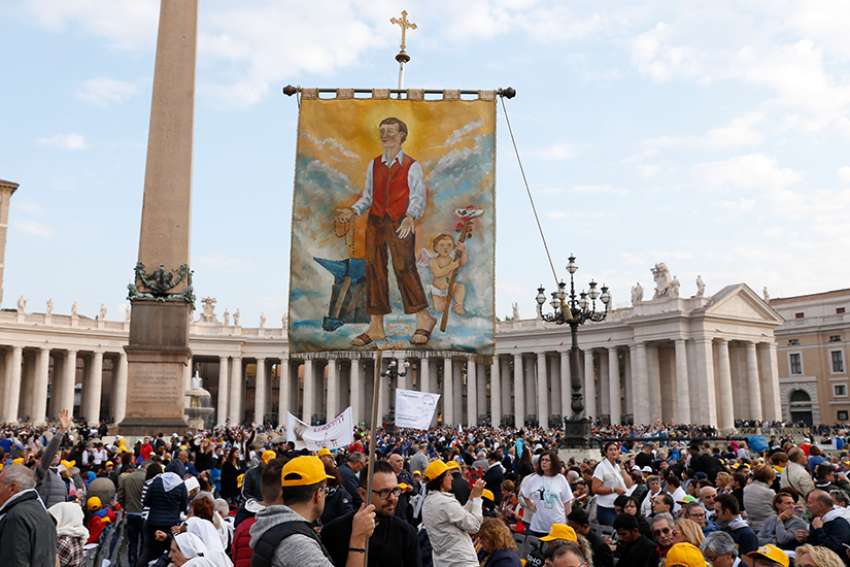 Vatican pilgrims at canonization support their local 'heroes'