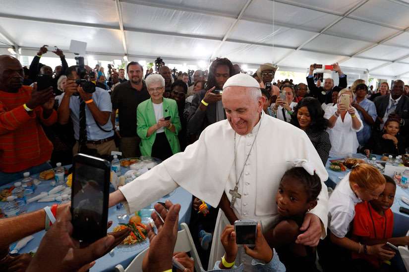 Pope's visit to Catholic Charities meal seen as sign of hope for the poor