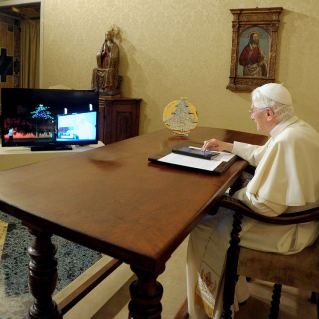Pope taps tablet, lights world's largest Christmas 'tree' 