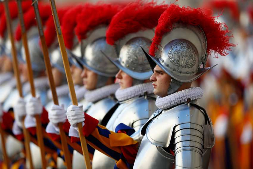 Pope Francis tells new Swiss Guards they represent a church that welcomes