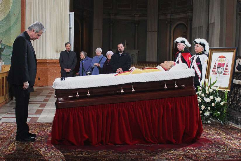Crowd gathers early to pay final respects to Cardinal Turcotte