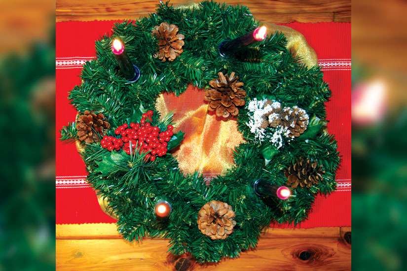 Wreath is symbolic of Christ’s light shining on a dark world