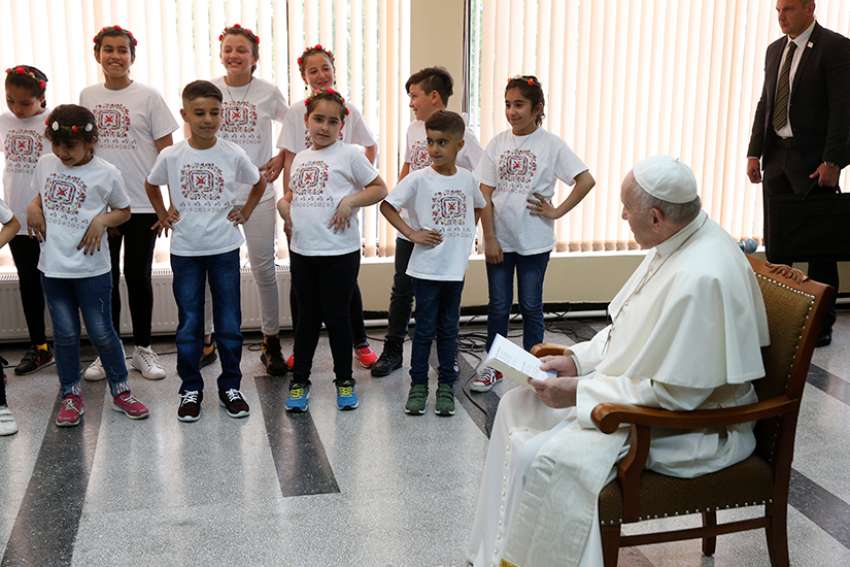 Roses and the cross: Pope meets refugees in Bulgaria