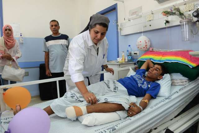 In Jerusalem hospital, staff and family help Gaza trauma patients