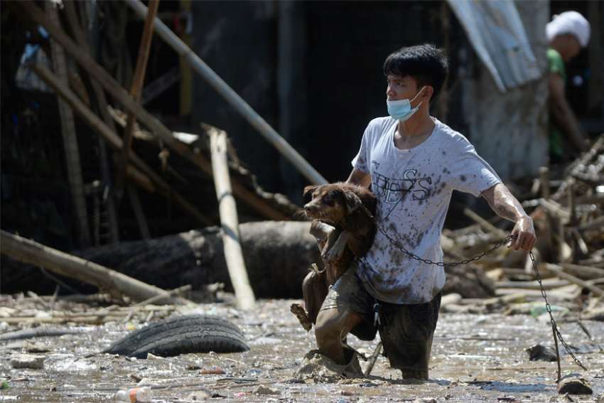Fifth storm in three weeks leaves people trapped in houses in Philippines