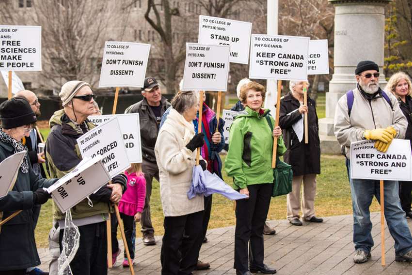 End 'effective referral' policy for doctors, protesters demand