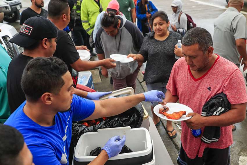 Prayers, aid offered amid floods as Texas parishes grapple with Harvey