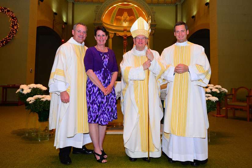 Bishop ordains father, son as deacons in a first for Green Bay Diocese