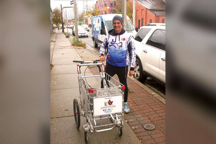 Cross-country trek behind a shopping cart raises awareness for homeless youth