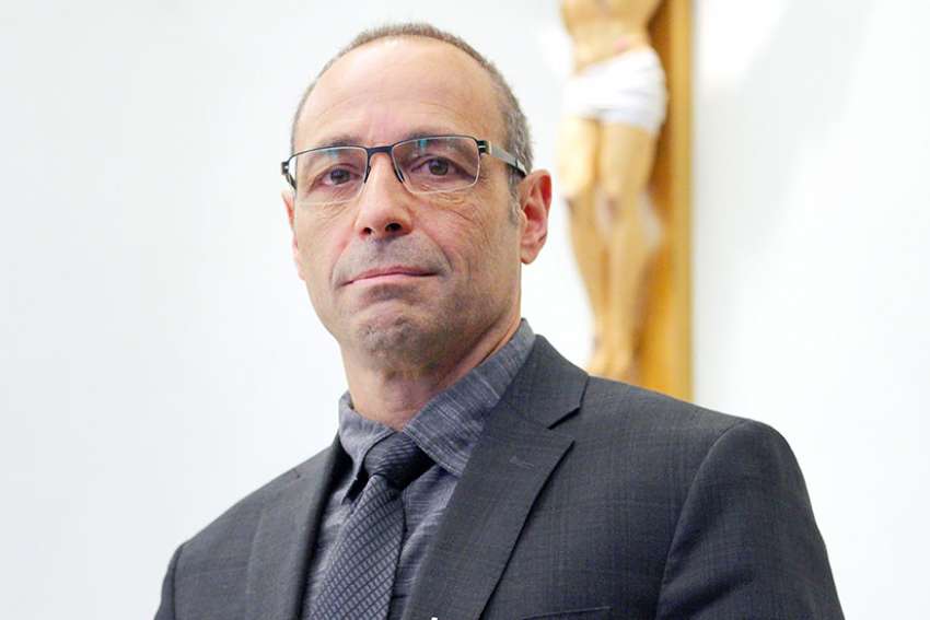 Veteran educator puts his faith into action