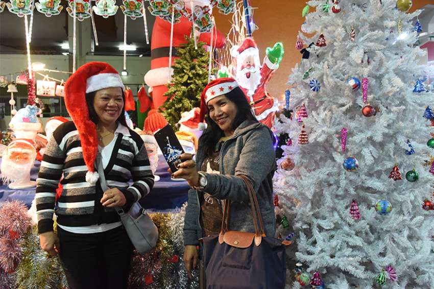 Israel's foreign workers visit pop-up Christmas market to help cure homesickness