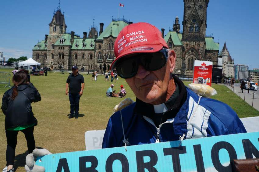 Priest keeps anti-abortion vigil on Parliament Hill for nearly 30 years