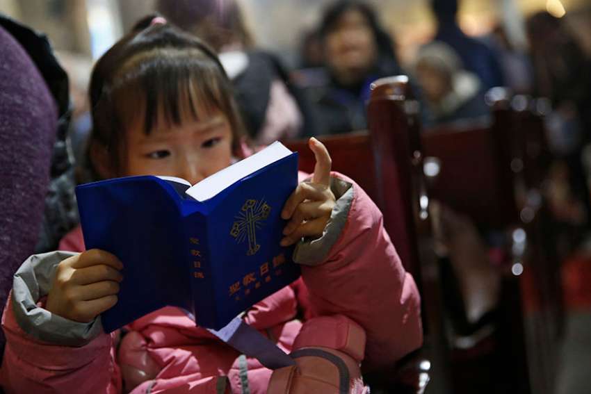 Outside cities, Chinese grandparents pass on faith to their grandchildren
