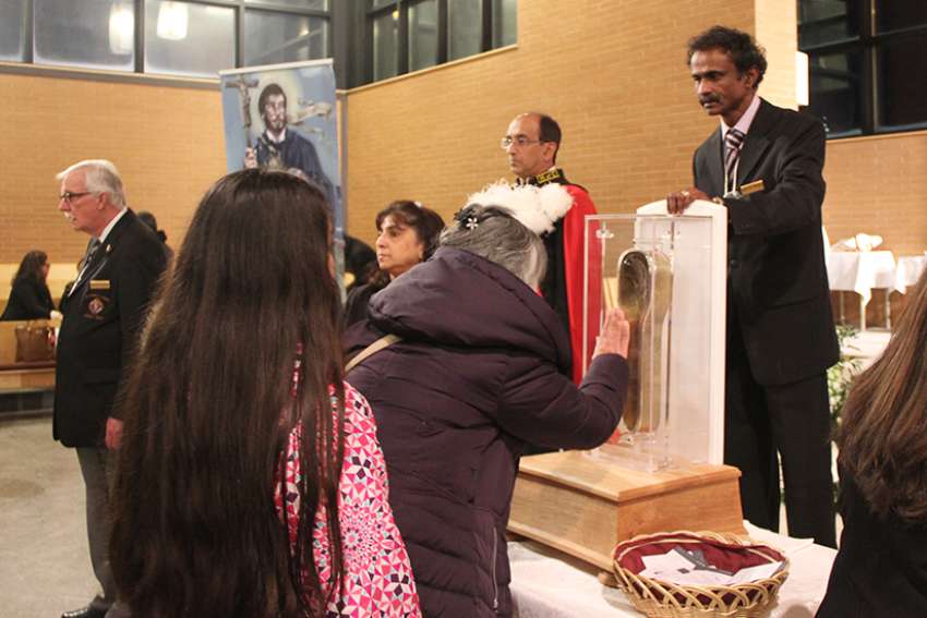 Mississauga youth encounter relic of their patron saint
