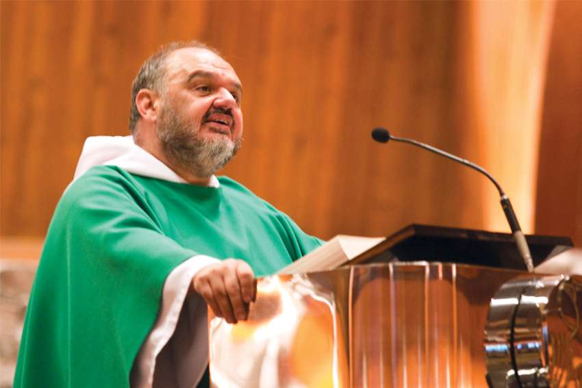 Fr. Vito: big man, bigger smile