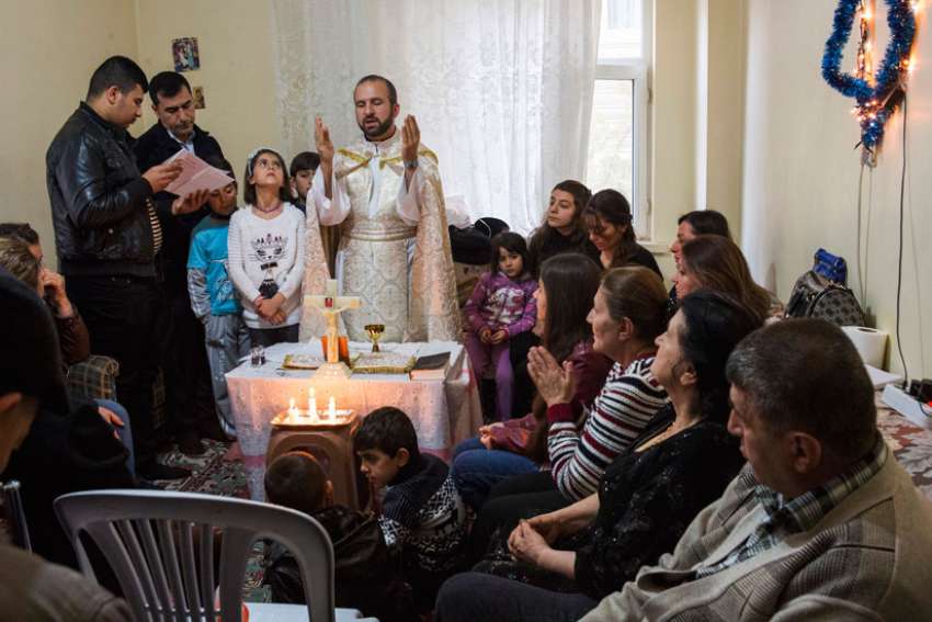 By plane, train and bus, Chaldean priest visits Iraqi refugees in Turkey