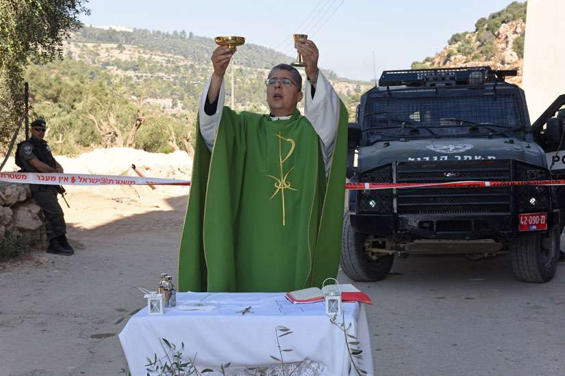 Priest offers Mass daily at destroyed West Bank olive orchards