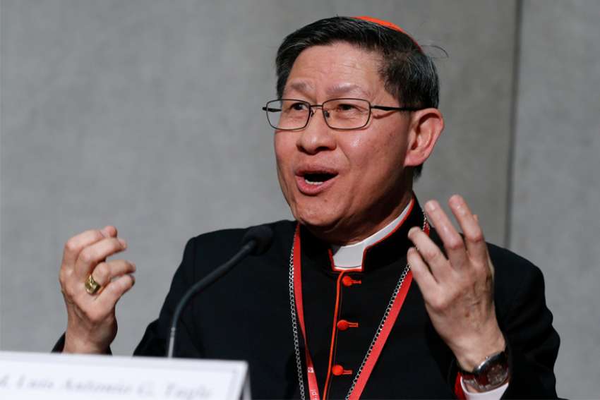 Thousands of Philippine Catholics march to defend church leaders