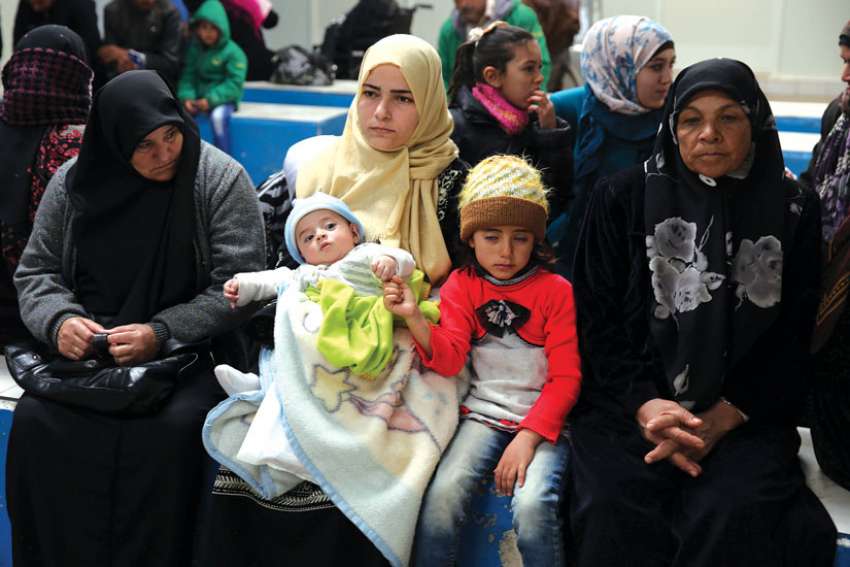 Promised safe haven in America, refugees now grounded by Trump