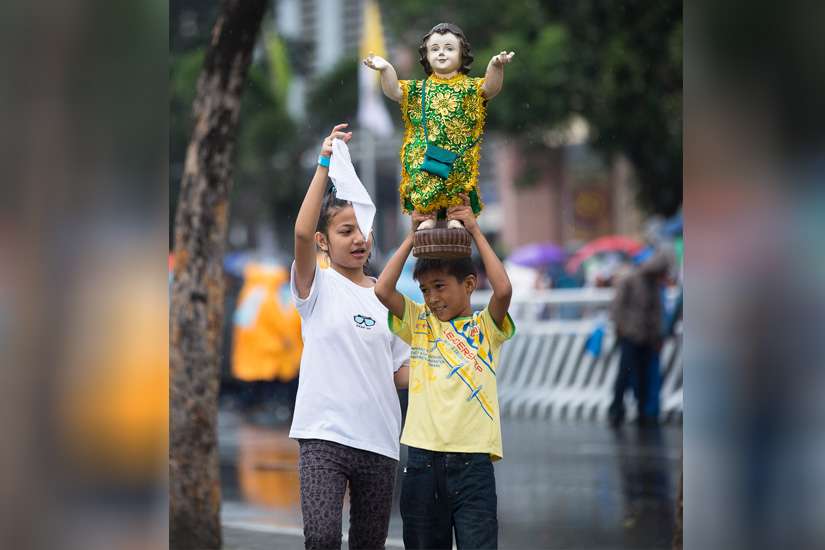 Filipinos bring Santo Nino statues for blessings from Pope Francis