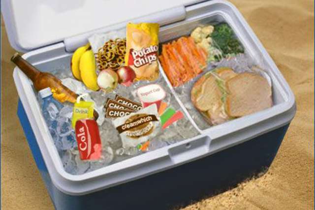 A lamp under a bushel basket and a cooler of food