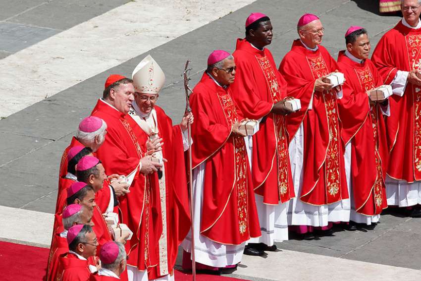 Pope tells new archbishops, cardinals not to be 'armchair Catholics,' but apostles