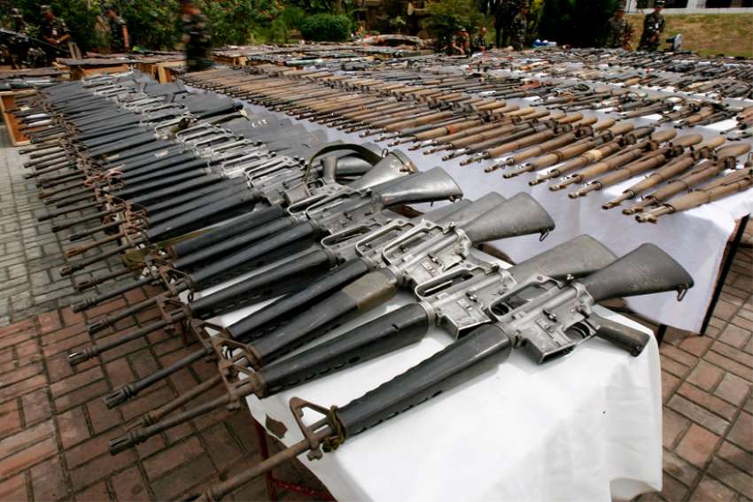 Slaying of nine Filipino activists in raid sparks outrage