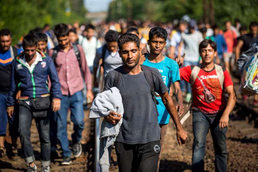 French residents greet Syrian refugees warmly, but many are wary