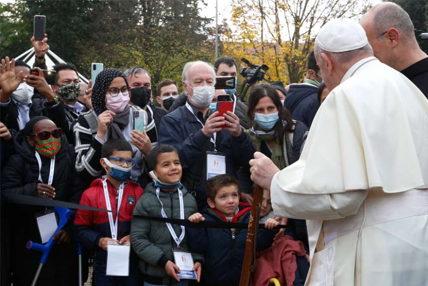 Pope Francis visits with poor in Assisi