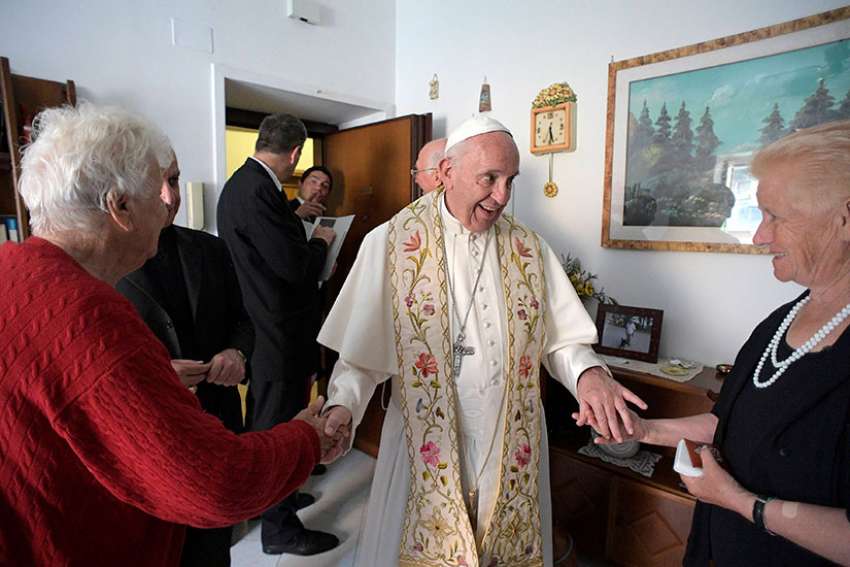 Pope goes door-to-door, blessing the homes of the poor