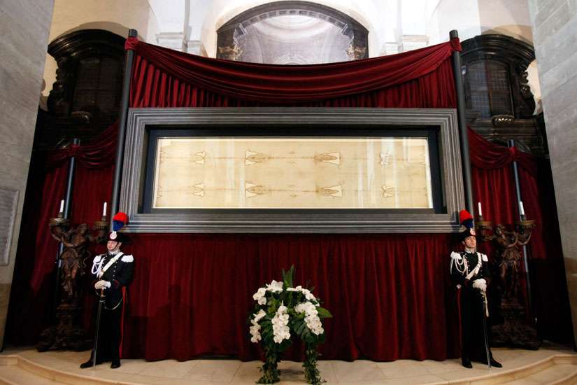 During shroud display, Turin reaches out to women who have aborted