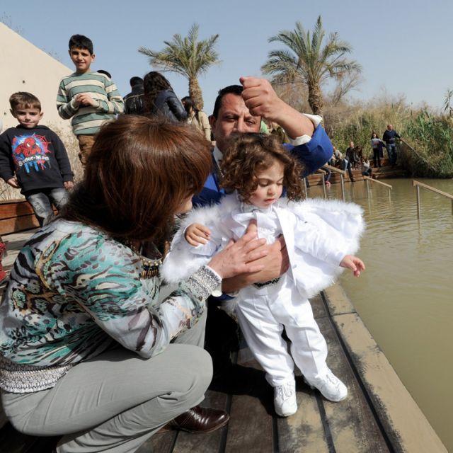 Young and old, hundreds of pilgrims seek baptism in Jordan River ritual 