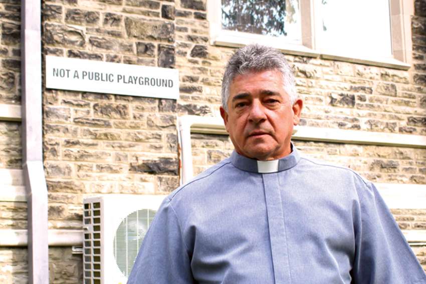 Priest stands by sign: ‘Not a playground!’