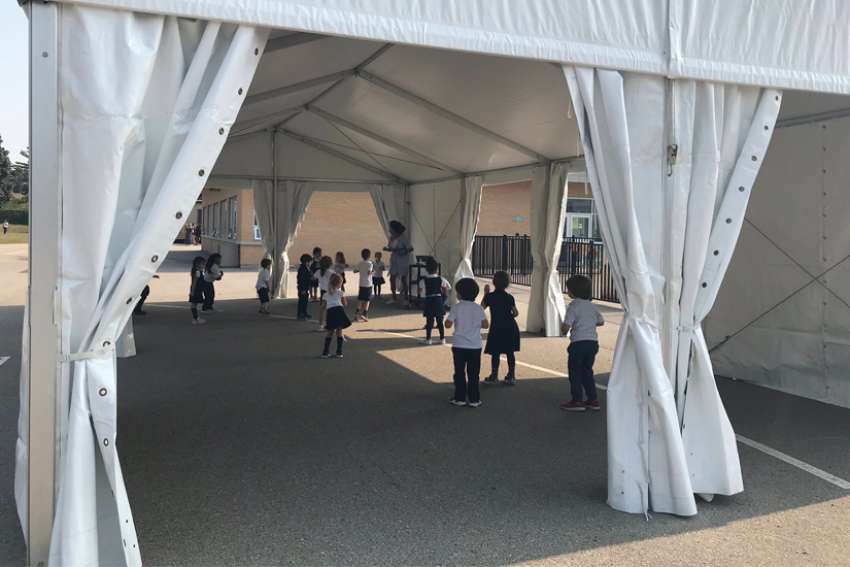 Schools utilizing tents as learning spaces