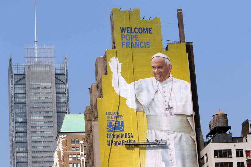 Mural of pope looks out over New York's Madison Square Garden Mass site