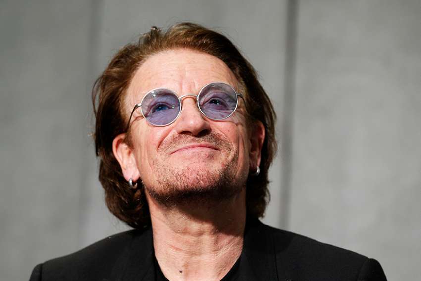 U2's Bono meets Pope Francis to sign charity agreement