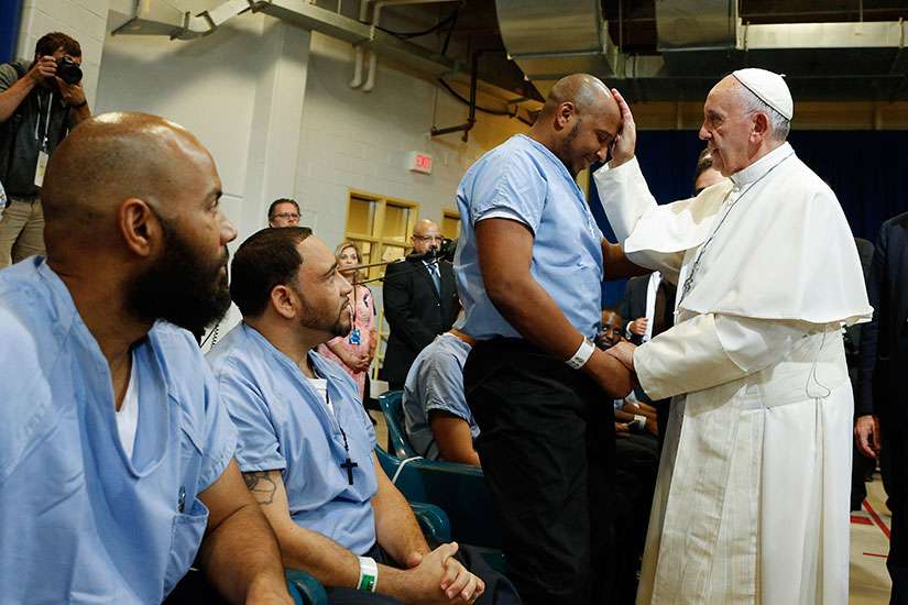 Visiting prison, pope says all people need forgiveness, cleansing