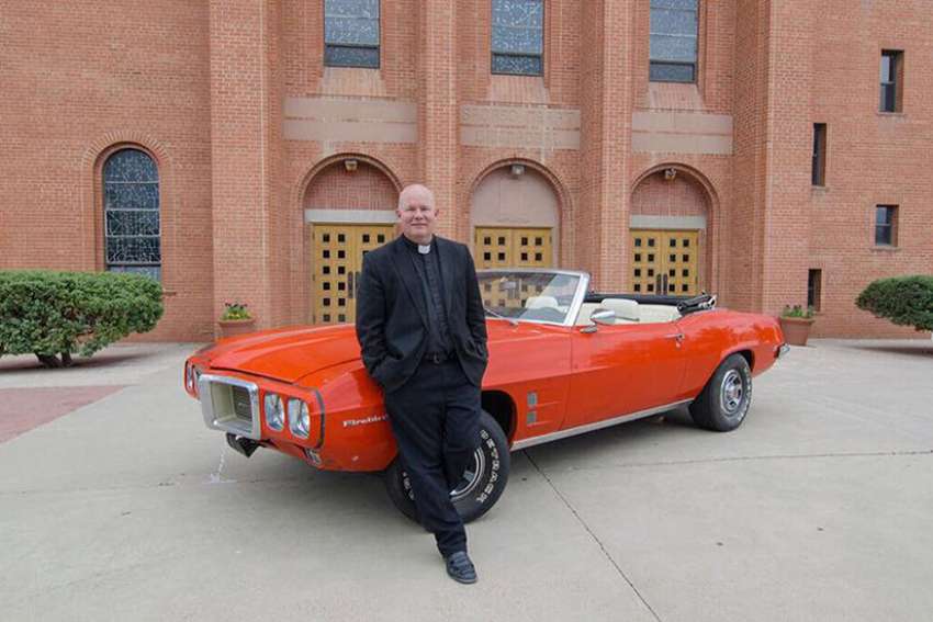 Priest's love of cars helps raise funds for vocations in poorest diocese
