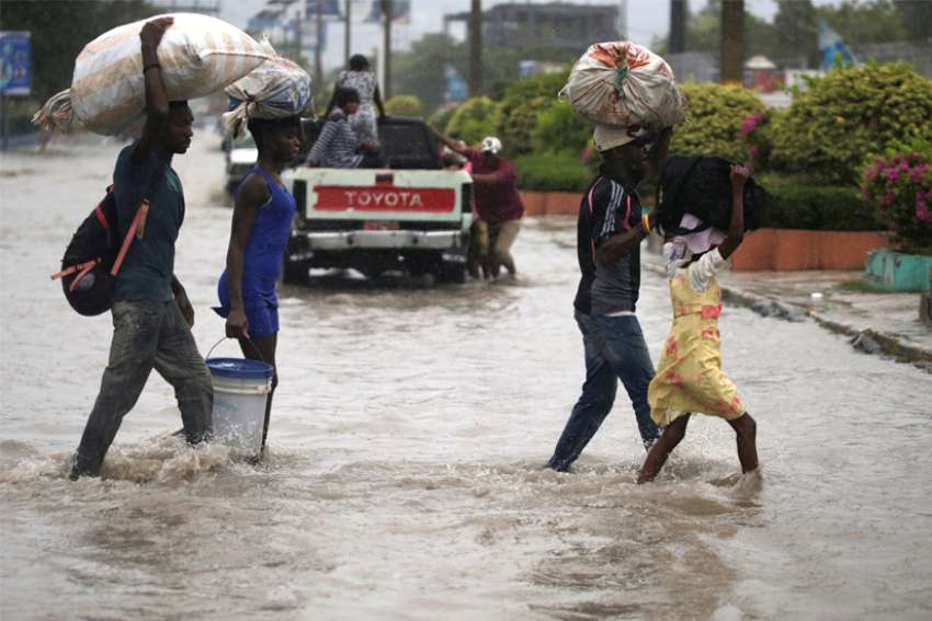 At least 12 dead as tropical storm lashes Haiti, Dominican Republic