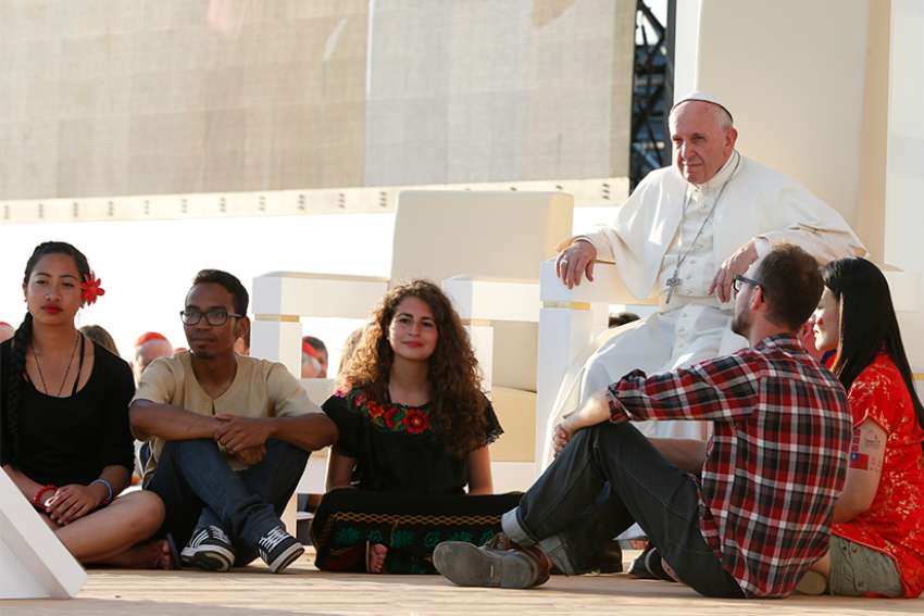 Serving others will change the world, Pope Francis says to youth