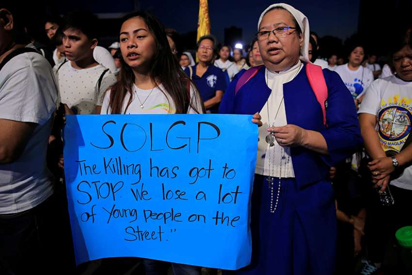 In marches around Philippines, Catholics protest threats to life