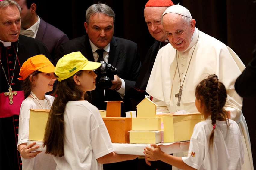 Pope tells children to remembers their roots while sharing his childhood memories