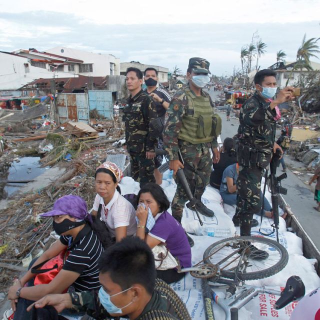 At Manila air base, distraught family members hope for plane to Leyte 
