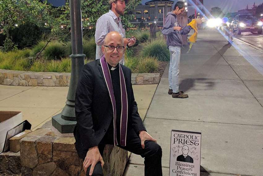 Priest plants himself at popular music festival, goes viral on Reddit