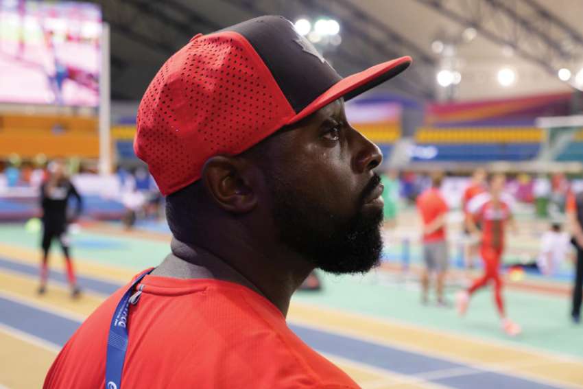Teacher, track coach pays it forward