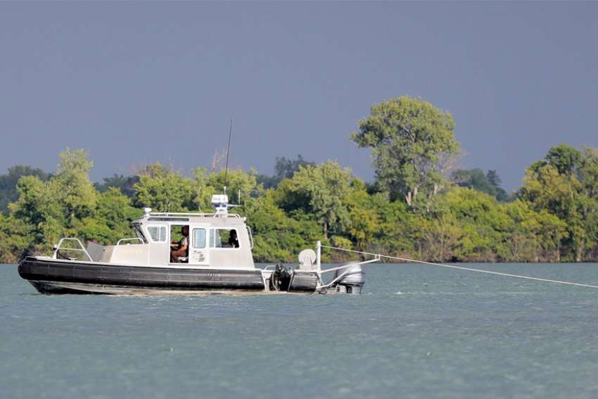 Body of missing parishioner found in Detroit River; search continues for priest