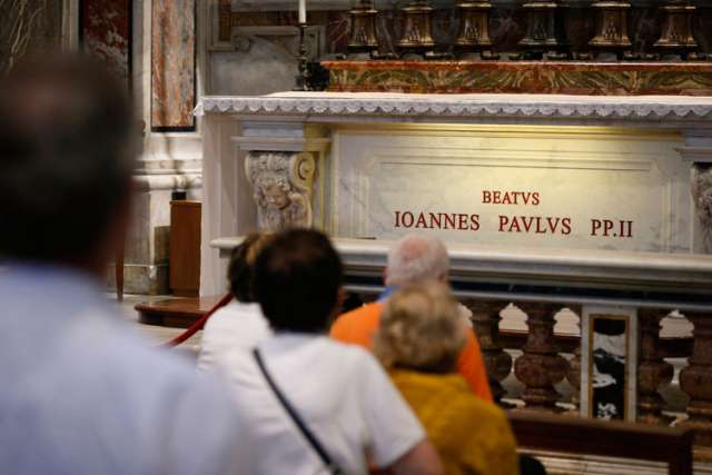 Letters left at John Paul's tomb show pilgrims see him as friend