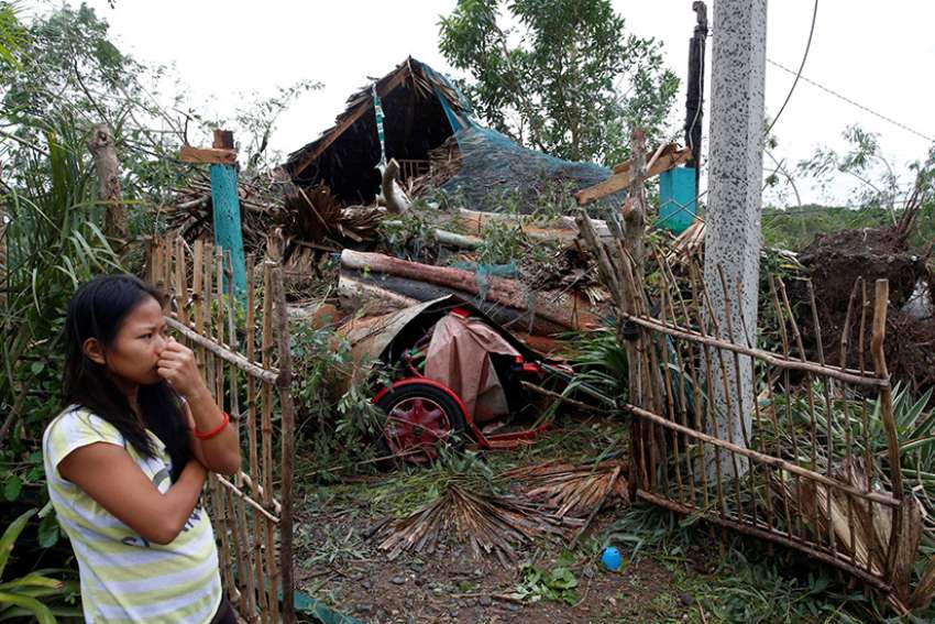 Typhoon ravages Philippines; response slowed because of Christmas holiday